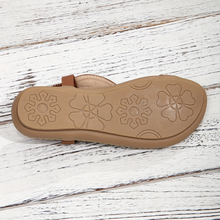 Summer essential: women's boho flat sandals with a beaded toe ring and eye-catching rhinestone details.