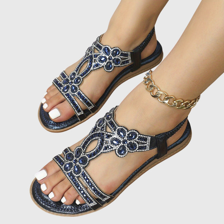 Slip-on flat boho sandals for women, adorned with rhinestones, ideal for summer vacation.