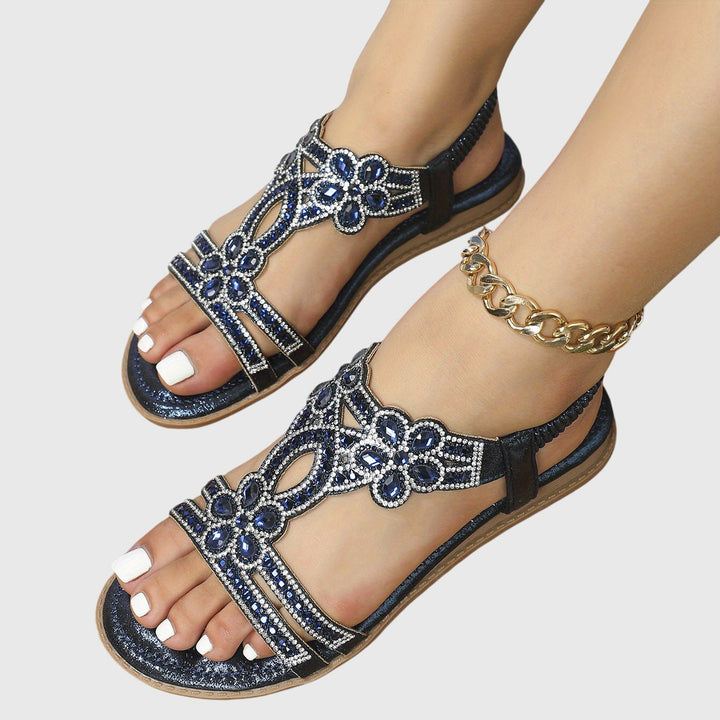 Women's embellished flat sandals with rhinestones, perfect for a casual boho vacation.