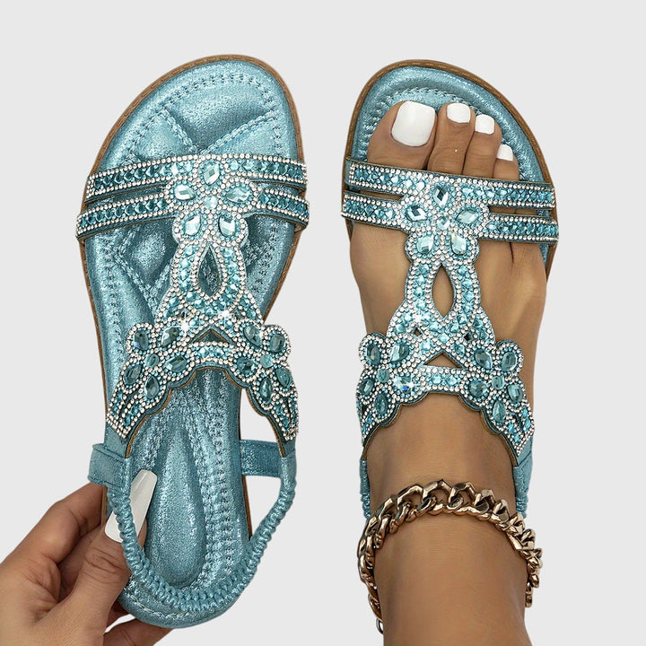 Chic rhinestone flat sandals for women, ideal vacation footwear with a boho embellished design.