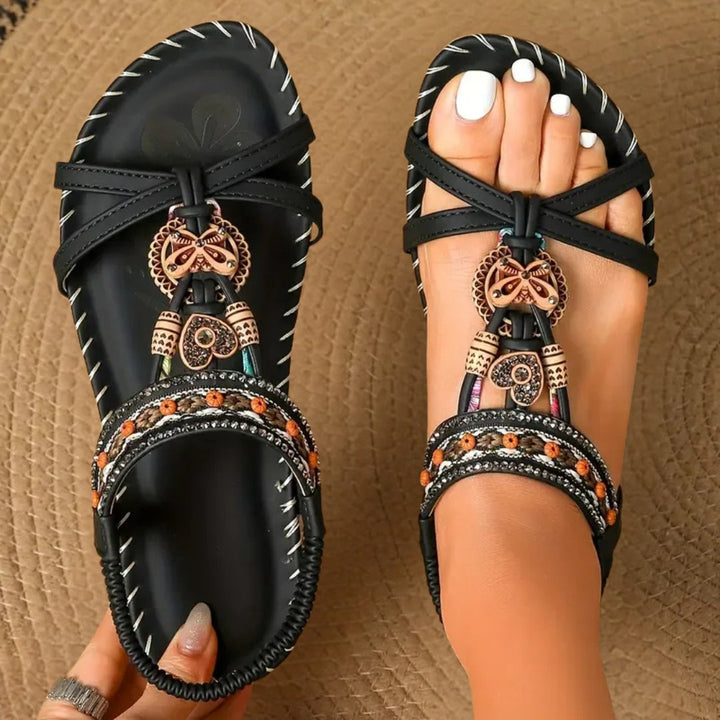 Stylish women's boho flat T-strap sandals, perfect casual summer footwear with orthopedic comfort.