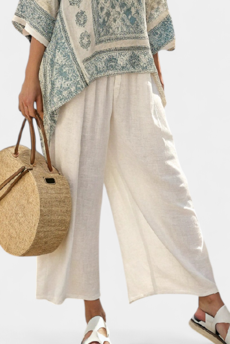Multi-color artisan-inspired women's boho floral block print two-piece set, featuring a batwing top & wide leg trousers.