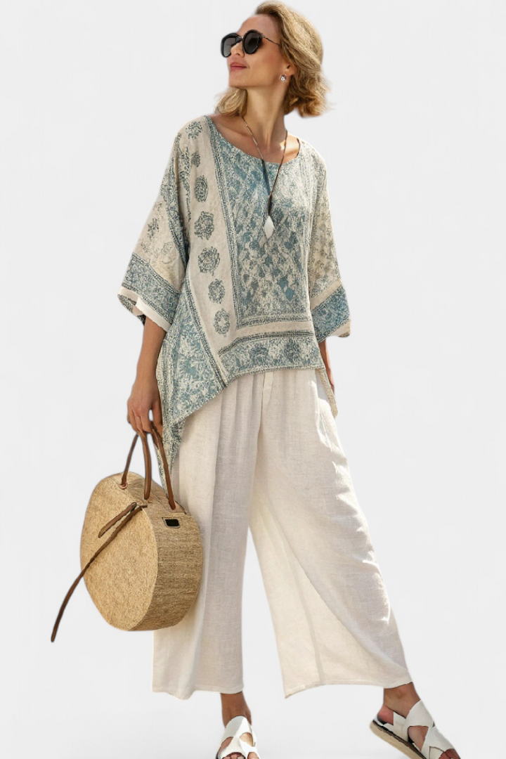 Elegant women's boho floral print loungewear set with comfortable batwing blouse and flowing wide leg pants for summer.