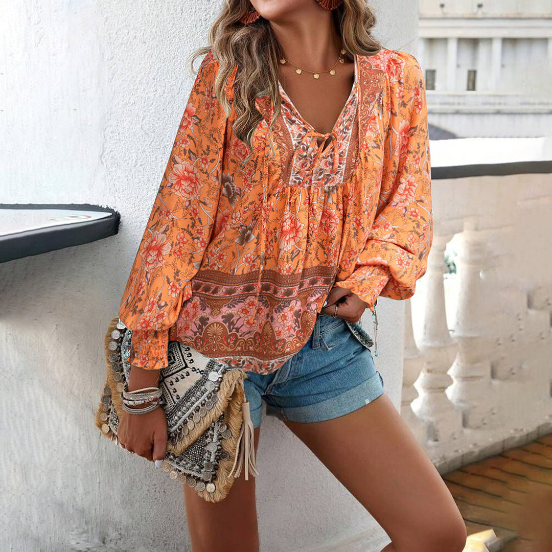 Women's V-neck boho floral loose top with elegant puff sleeves, a stylish choice for spring & summer fashion.