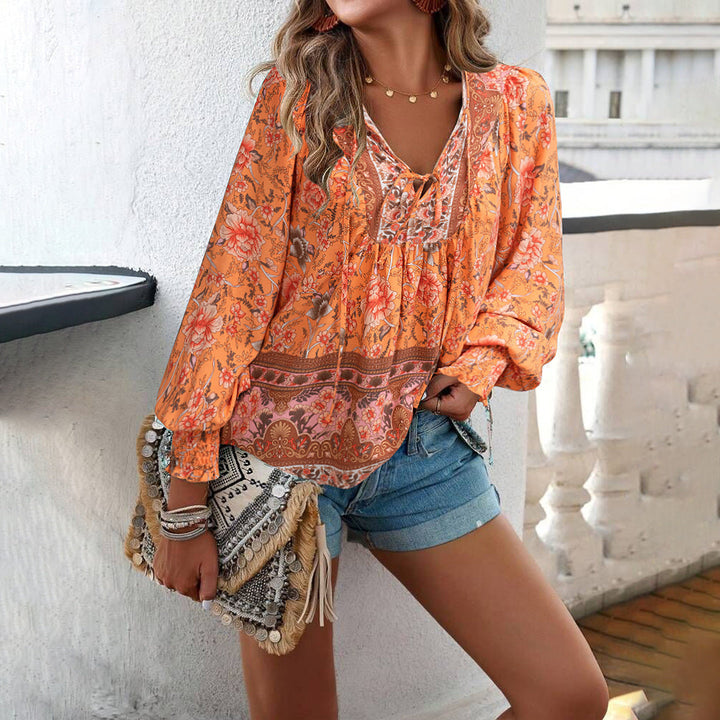 Women's V-neck boho floral loose top with elegant puff sleeves, a stylish choice for spring & summer fashion.