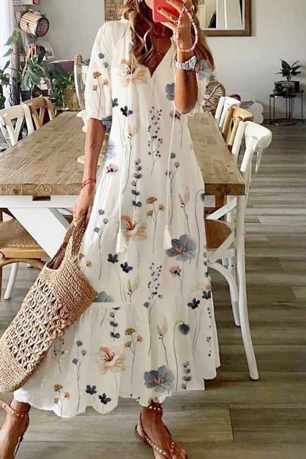 Women's boho floral maxi dress with tassel V-neck, perfect for summer vacations and beach outings.