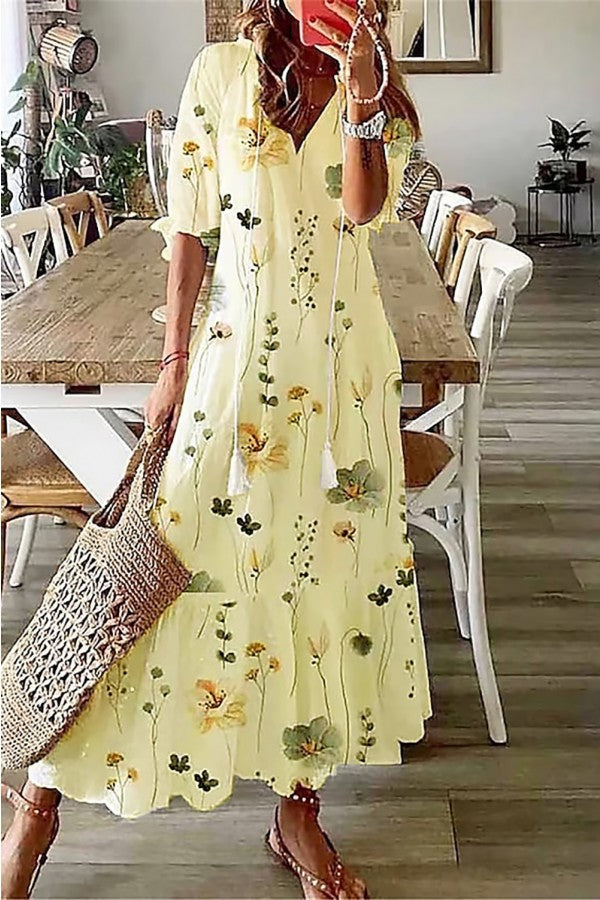 Stylish women's long floral maxi dress featuring a chic tassel V-neck, great for a breezy summer look.