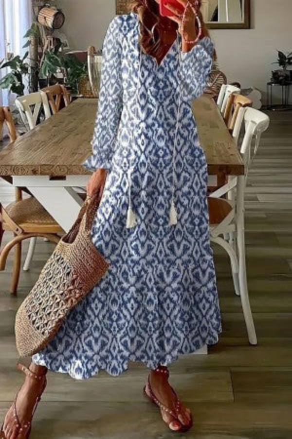 Casual chic women's floral boho maxi dress with a V-neck, suitable for resort wear or a relaxed summer day.