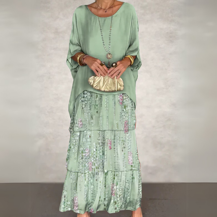 Elegant women's boho two-piece maxi dress featuring a loose batwing top and tiered skirt.