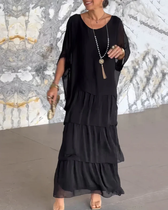 Boho women's two-piece maxi dress featuring a comfortable batwing top and a tiered flowy skirt.