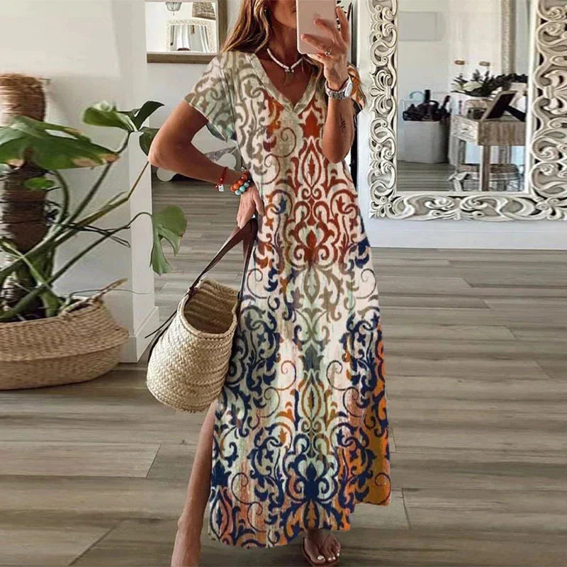 Women's boho maxi dress with short sleeves, vibrant paisley print, v-neck, and flowy silhouette, perfect for summer.