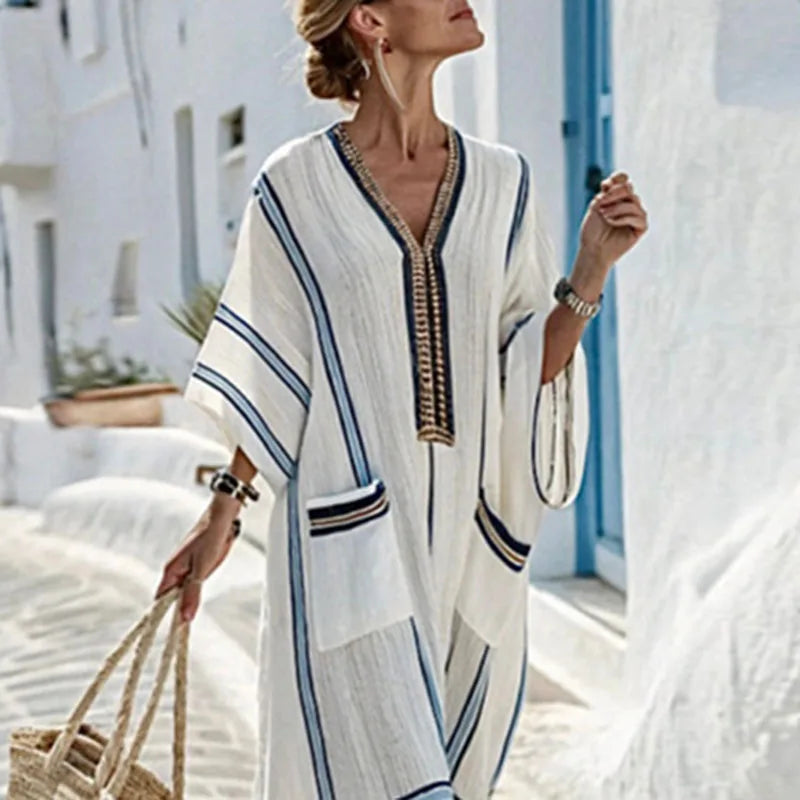 Flowy striped V-neck maxi dress for women, ideal beach wear or comfortable casual summer attire.