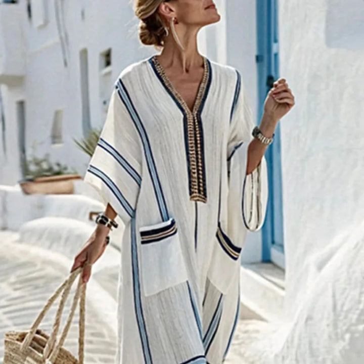 Flowy striped V-neck maxi dress for women, ideal beach wear or comfortable casual summer attire.
