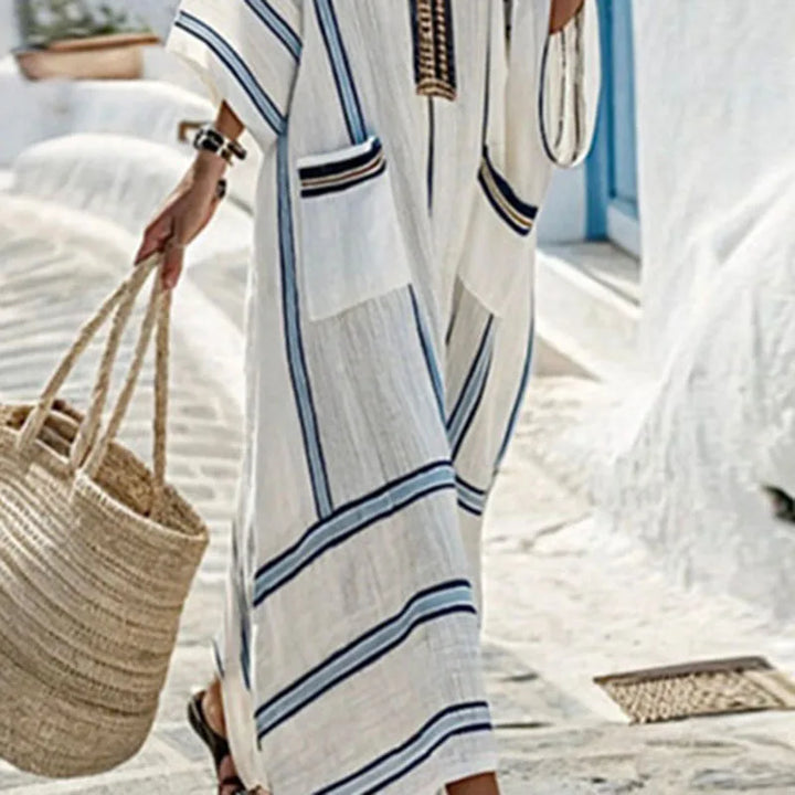 Elegant women's boho striped maxi dress, featuring a flattering V-neck, great for any summer occasion.