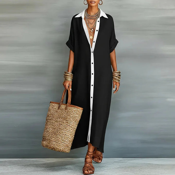 Women's elegant boho maxi dress with a striking contrast print, short sleeves & practical button-front design.