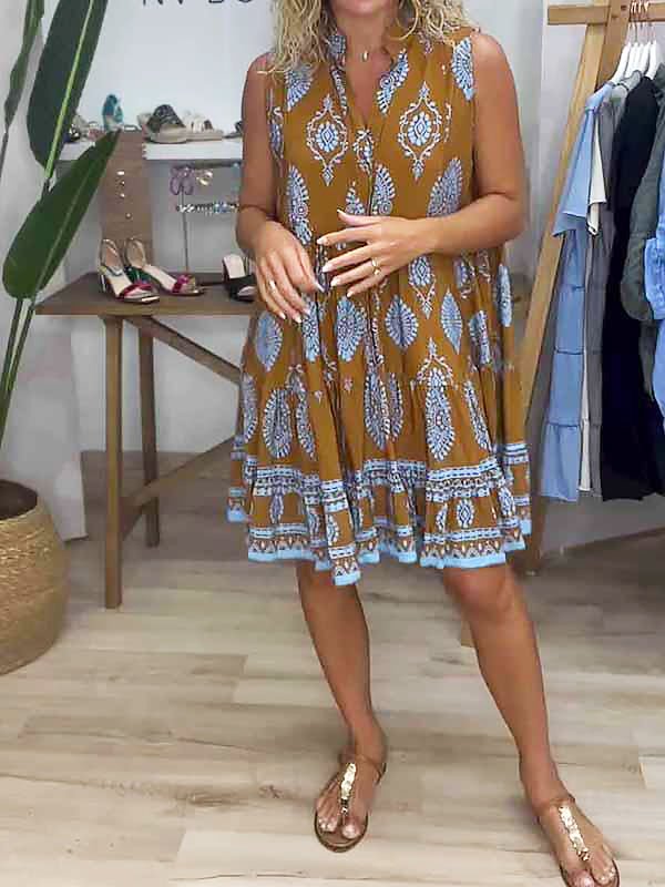 Women's boho medallion print smock mini dress with tiered ruffles, perfect for summer vacations. Flowy, sleeveless design.