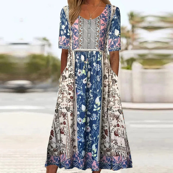 Comfortable women's midi dress with a unique boho print, short sleeves, round neck, and essential side pockets for daily wear.