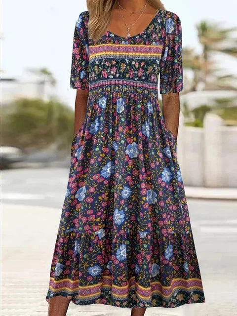 Elegant women's boho print midi dress, designed with a flattering round neck, short sleeves, and handy side pockets for comfort.