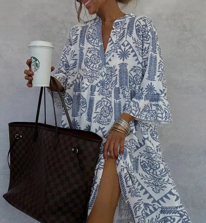 Flowy a-line patterned boho dress for women, featuring a flattering V-neckline & comfortable 3/4 sleeves.