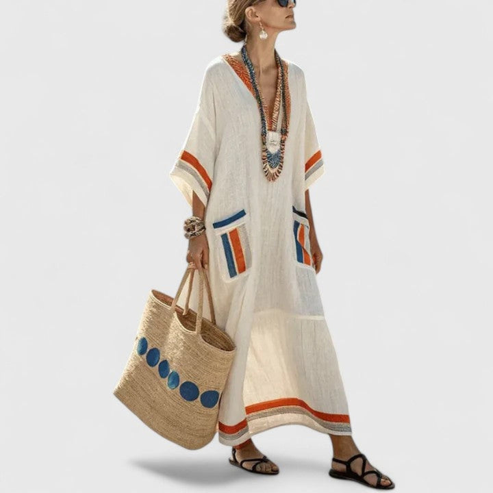 Versatile women's V-neck striped maxi dress, loose kaftan design with pockets, suitable for casual or vacation.