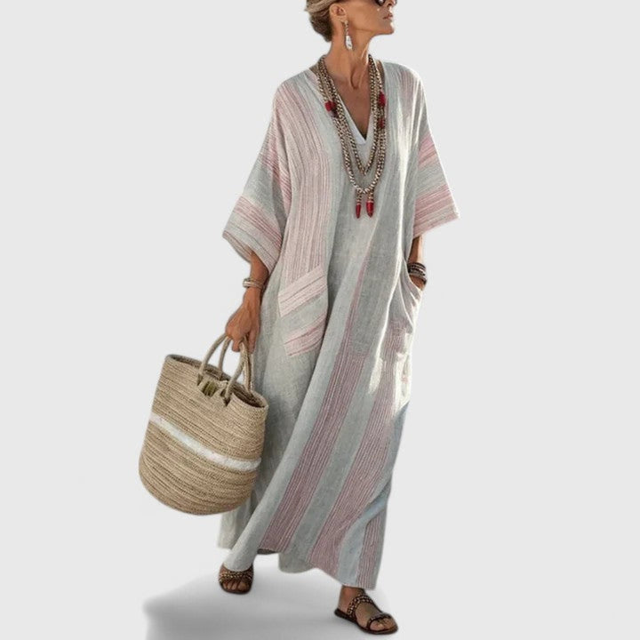 Striped women's maxi dress, boho style, featuring a chic V-neck, loose fit, and essential pockets for summer wear.
