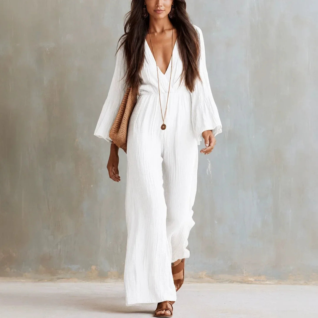Women's boho wide leg jumpsuit with deep V-neck & flowy flare sleeves, perfect for a casual chic summer look.