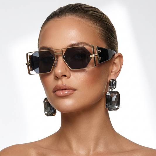 Women's bold aviator sunglasses with gold frames and 100% UV protection, a stylish fashion accessory.