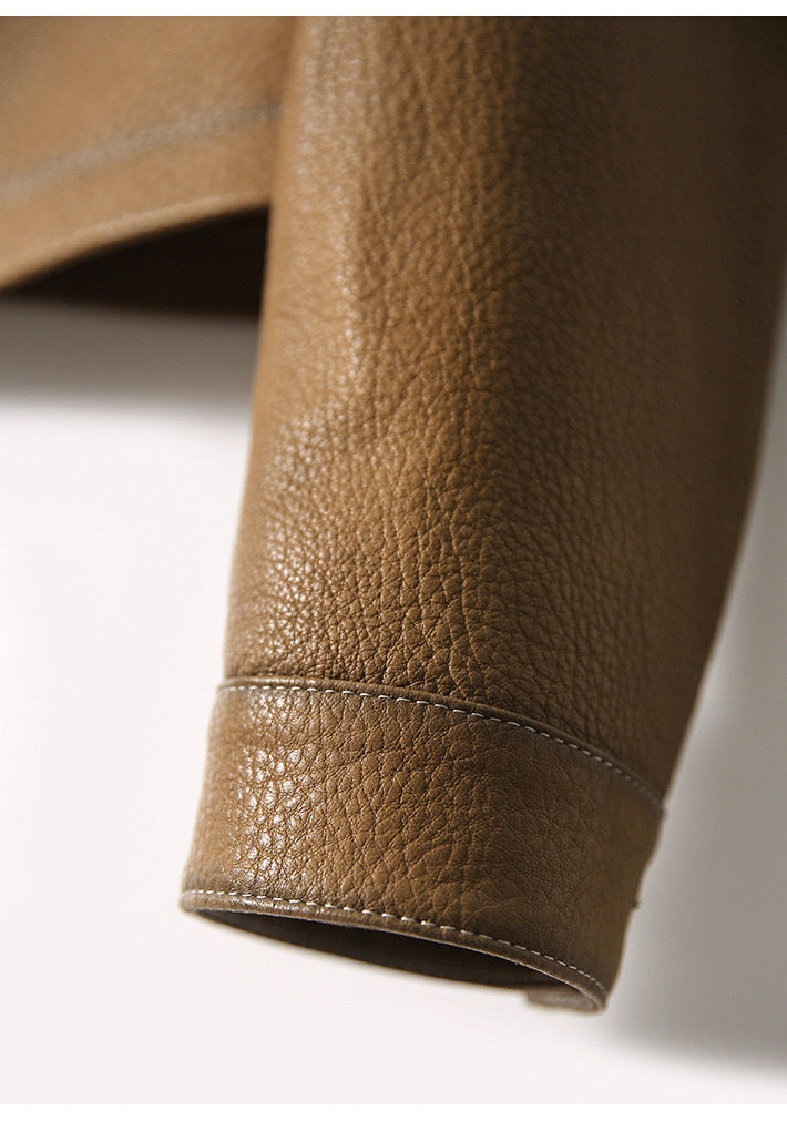 Full view of brown women's cropped moto jacket. Stylish biker outerwear, an edgy fashion statement piece.