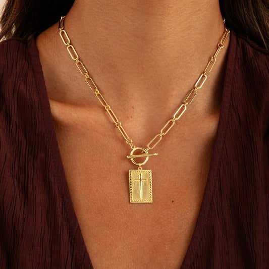 Women's bold paperclip chain cross pendant necklace in gold or silver. Stylish statement fashion jewelry.