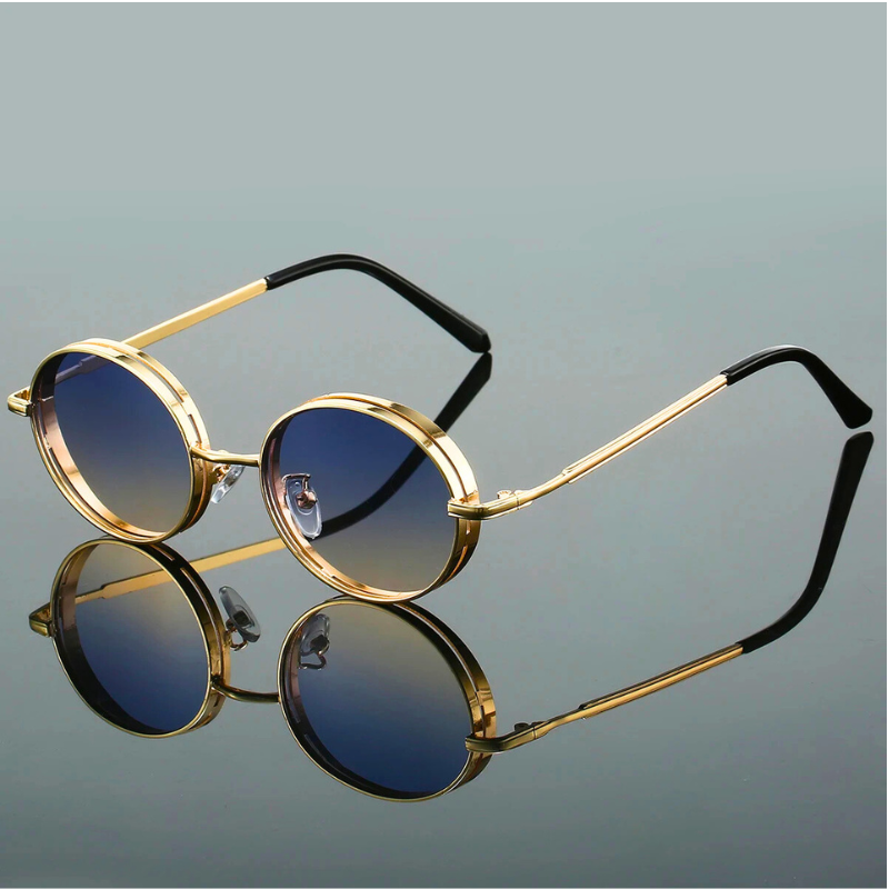 Stylish women's round sunglasses, bold design with gilded frame, offering full UV400 eye protection.