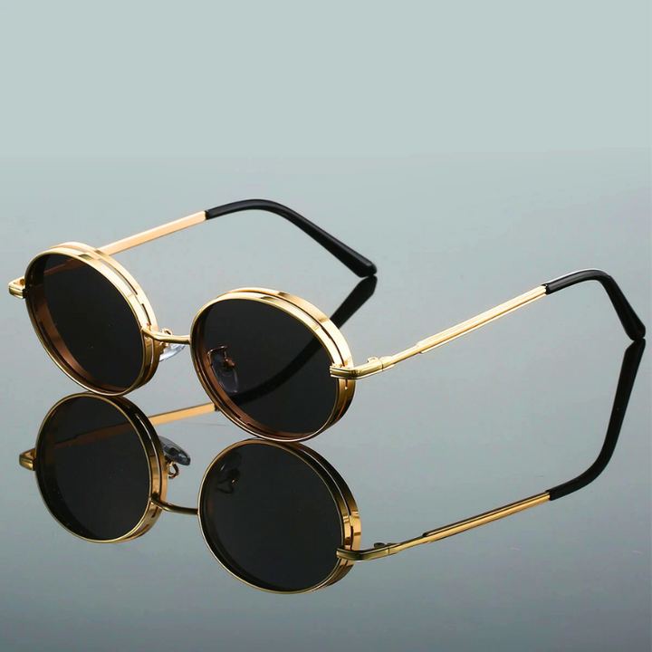 Fashionable women's bold round sunglasses, gilded metal frame. UV400 protection eyewear, adjustable fit.