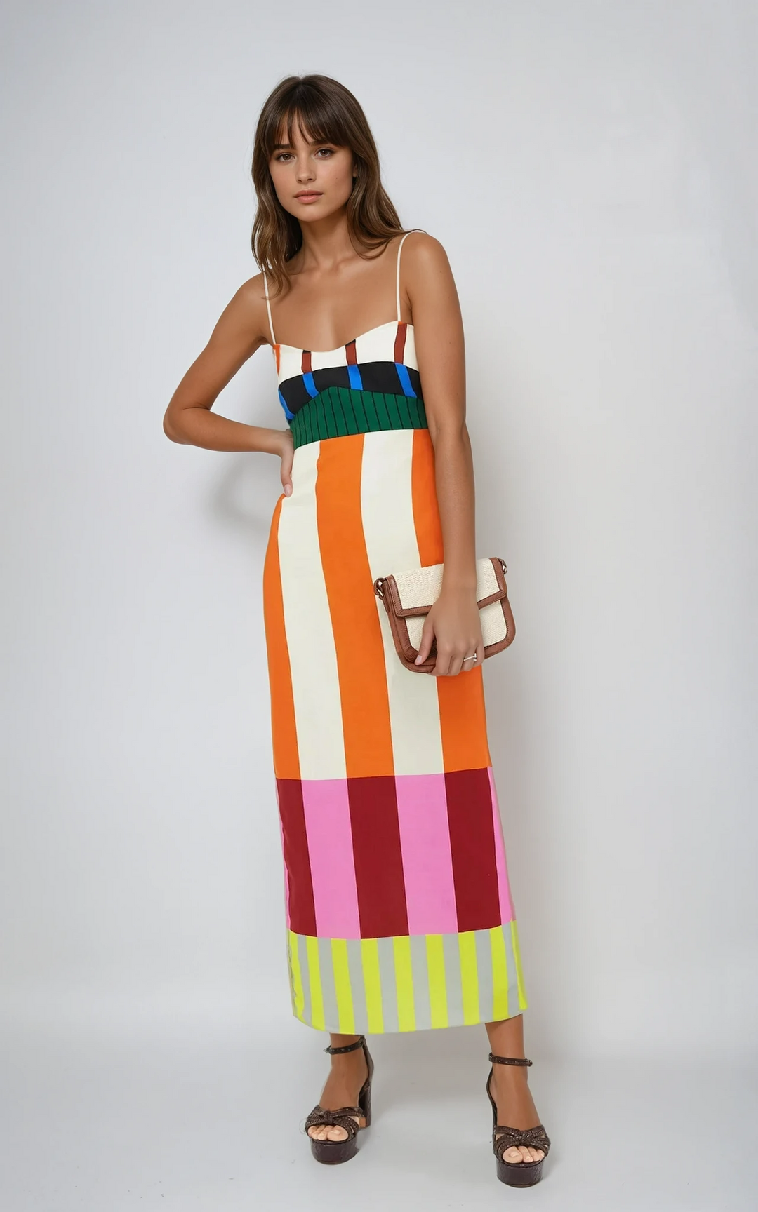 Trendy women's colourblock midi bodycon dress with spaghetti straps, a chic statement for evening wear.