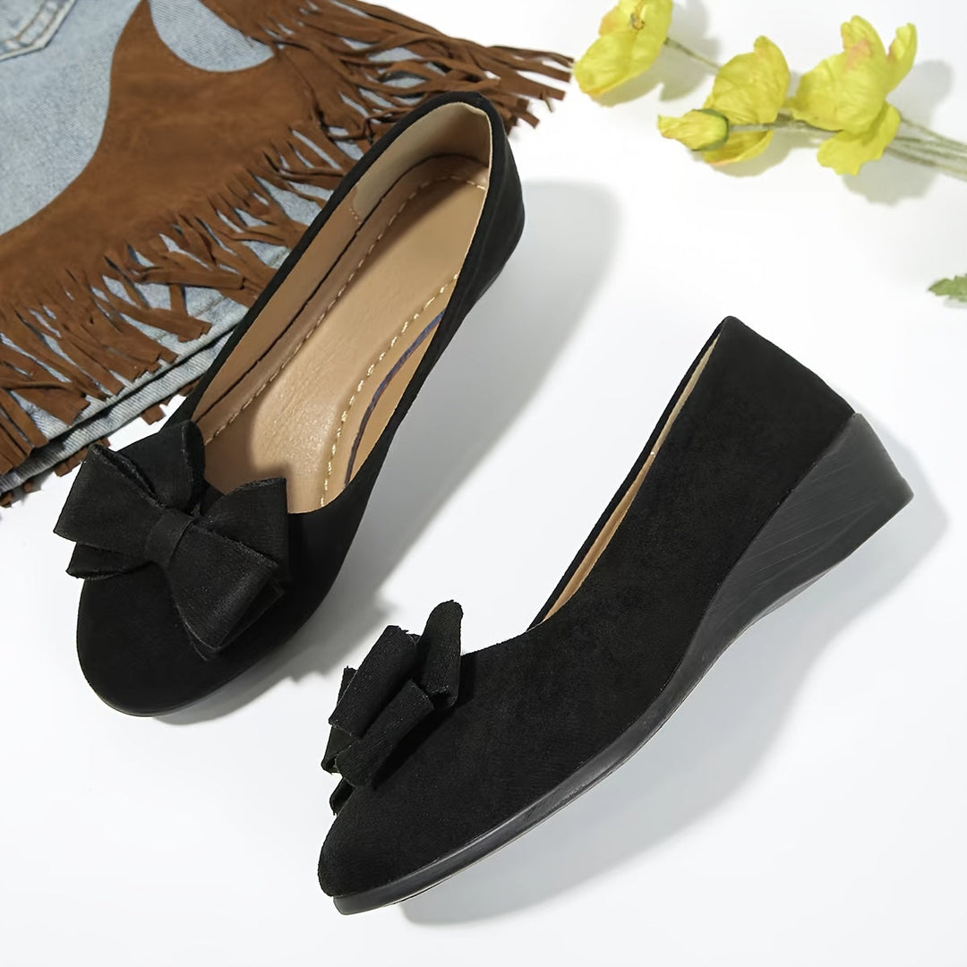 Everyday women's comfortable wedge flats, round toe, bow detail, easy slip-on style.