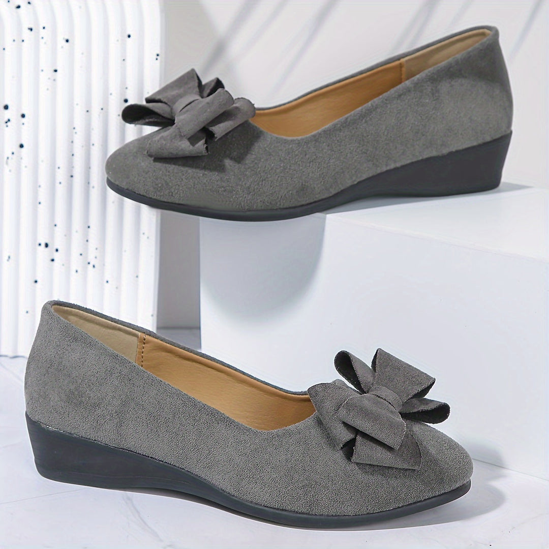 Comfortable women's slip-on wedge flats with a bow, round toe, suitable for all-day wear.