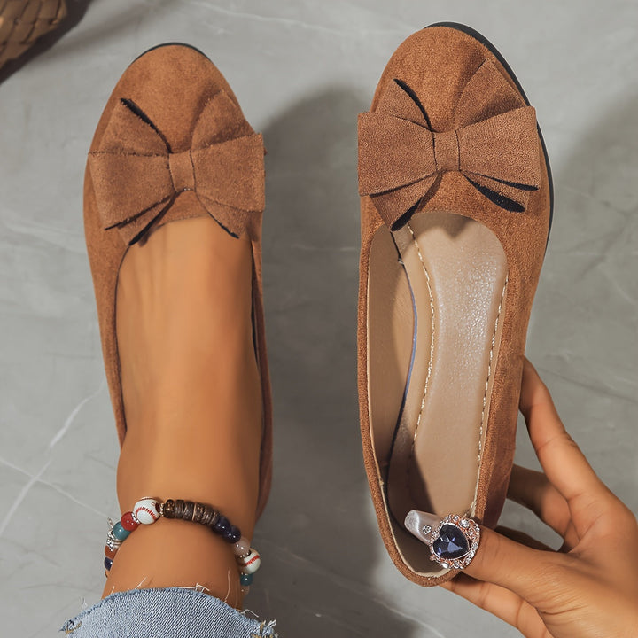 Versatile women's everyday wedge flats, round toe, slip-on, with a sweet bow detail.
