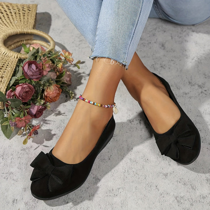 Black comfortable women's round toe wedge ballet flats, elegant bow, slip-on design.