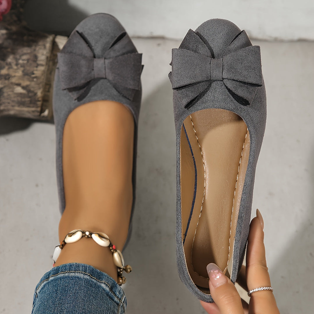 Red women's casual wedge ballet flats with a round toe and bow, easy slip-on style.