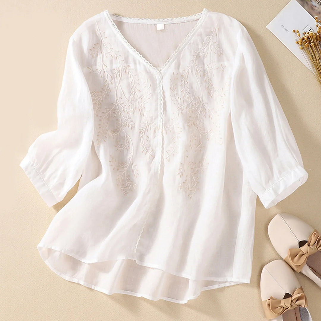 Flowy women's breathable embroidered shirt, an elegant summer top with artistic detail for casual wear.