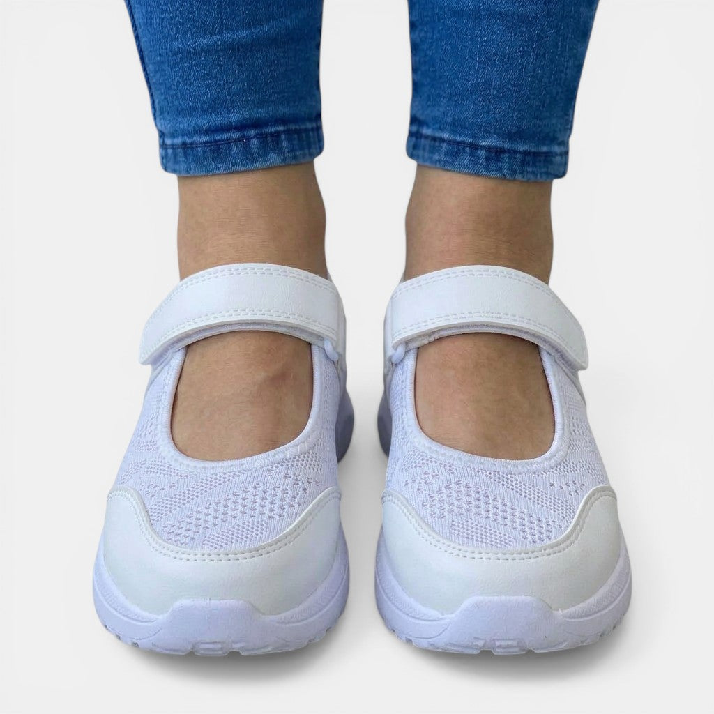 White women's slip-on sneakers with orthopedic support, breathable for casual all-day wear.