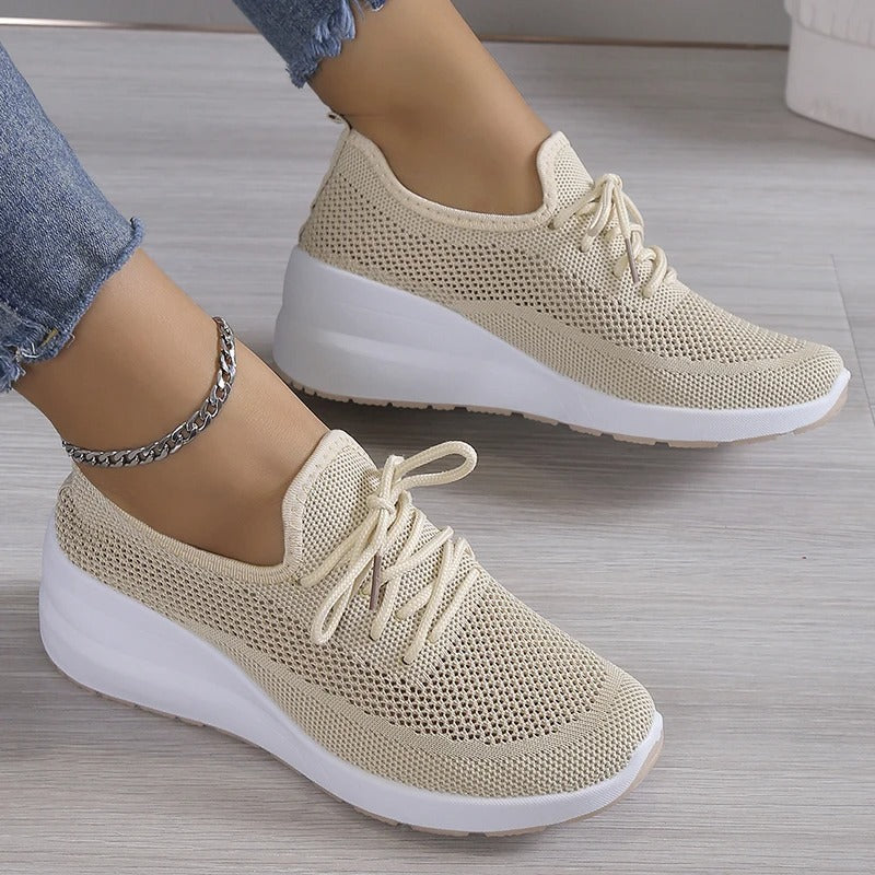 Women's breathable platform wedge sneakers, perfect for elevated comfort and casual fashion.