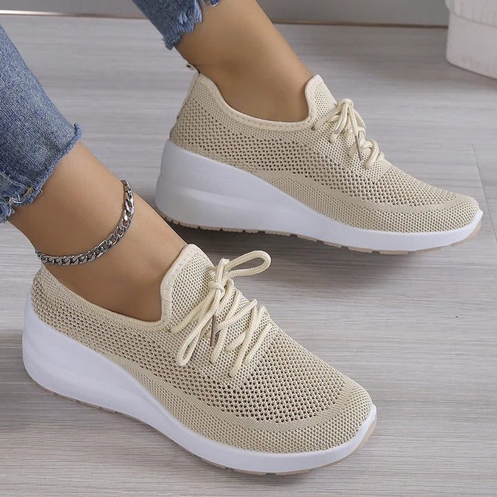 Women's breathable platform wedge sneakers, perfect for elevated comfort and casual fashion.