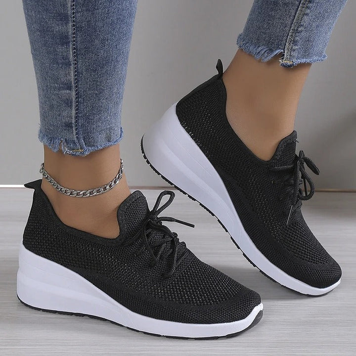 Comfortable women's breathable platform wedge sneakers, blending modern design with athleisure appeal.