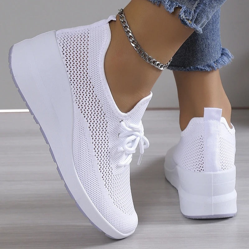 Women's breathable wedge platform sneakers, providing comfortable support and a stylish, elevated look.