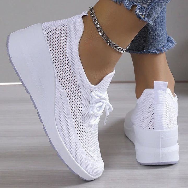 Women's breathable wedge platform sneakers, providing comfortable support and a stylish, elevated look.