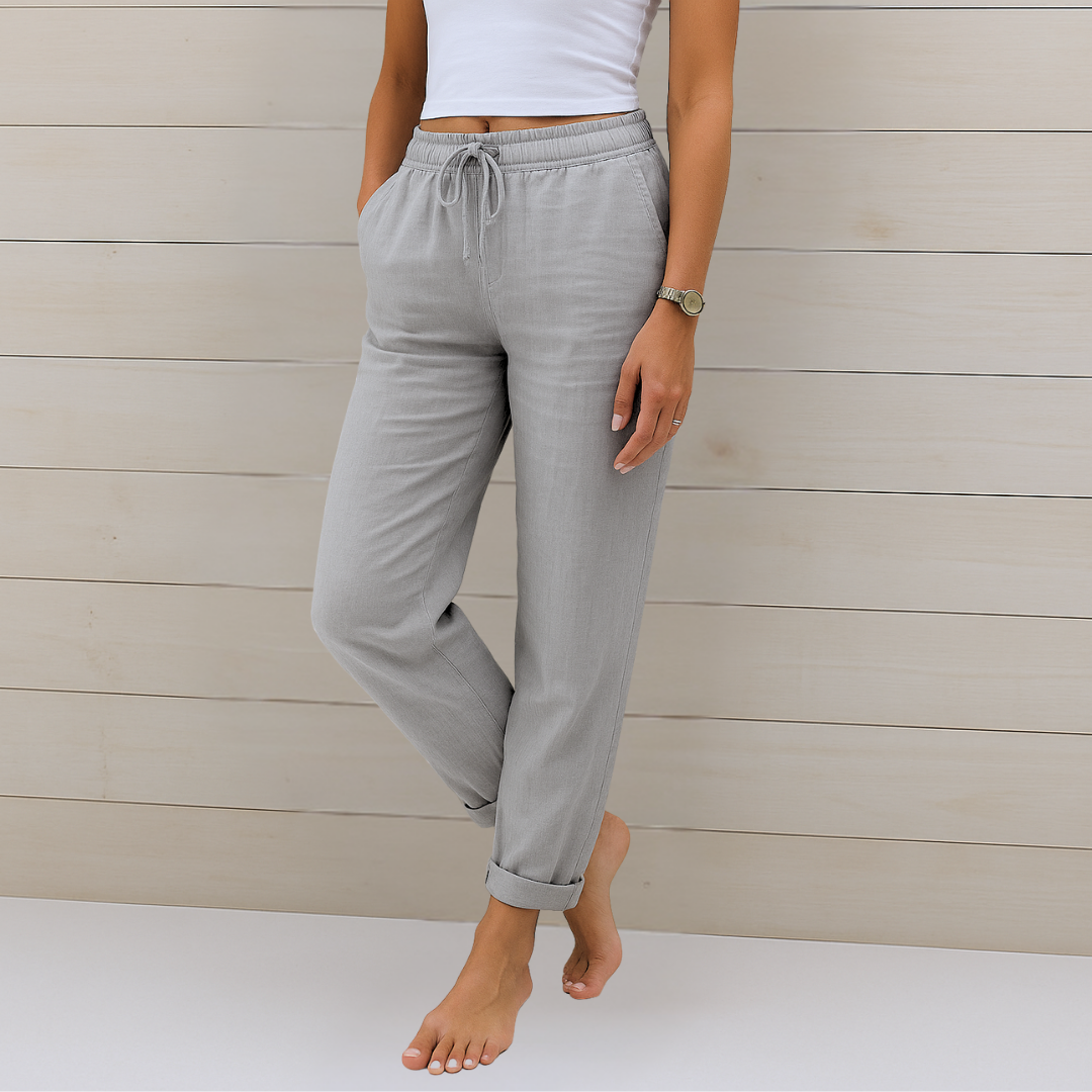 Full view of women's relaxed fit fashion trousers in a breathable fabric, showcasing a comfortable elastic waist.