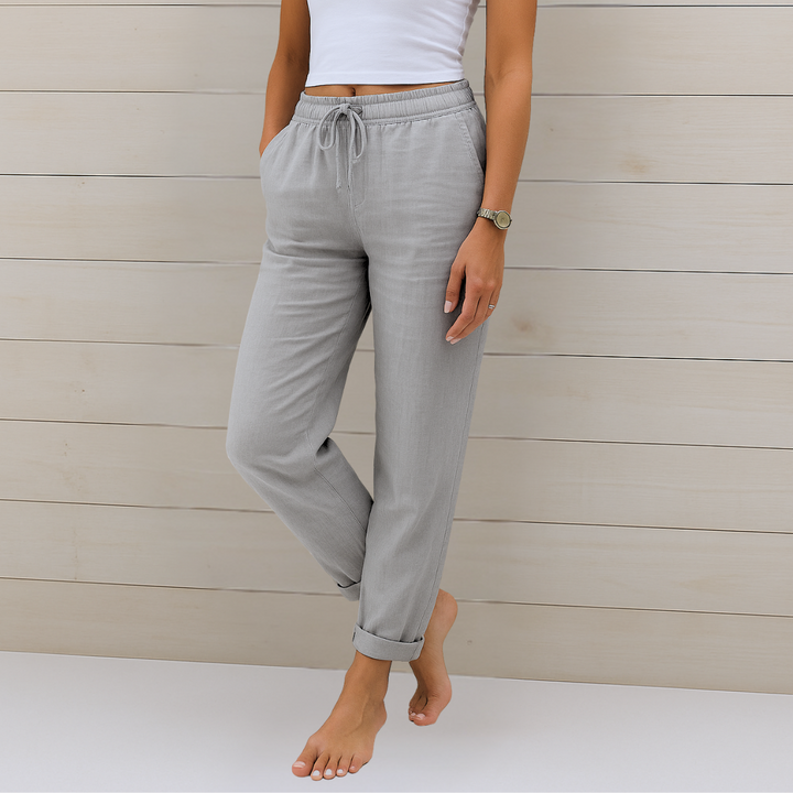 Full view of women's relaxed fit fashion trousers in a breathable fabric, showcasing a comfortable elastic waist.
