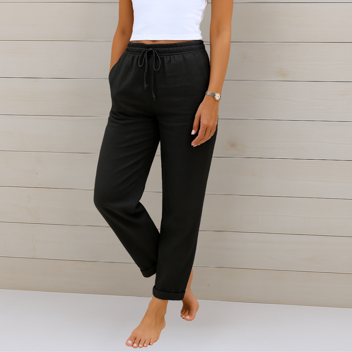 Woman showcasing breathable, relaxed fit women's trousers with elastic waist for comfortable movement and style.