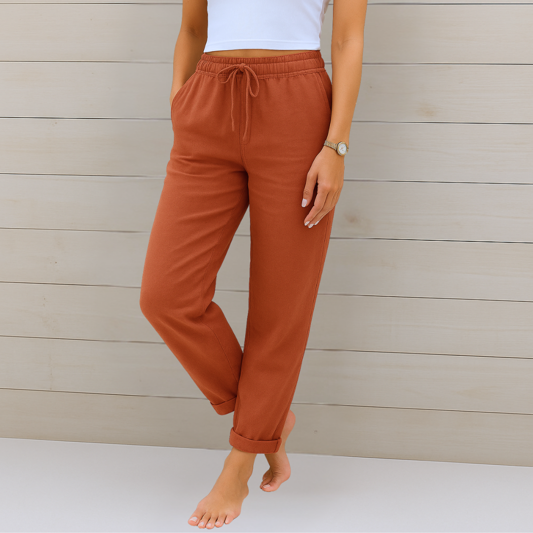 Close-up of the comfortable elastic waist and breathable fabric on women's relaxed fit casual trousers.