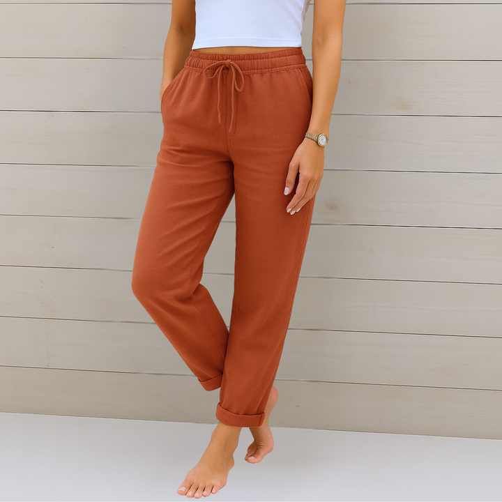 Close-up of the comfortable elastic waist and breathable fabric on women's relaxed fit casual trousers.