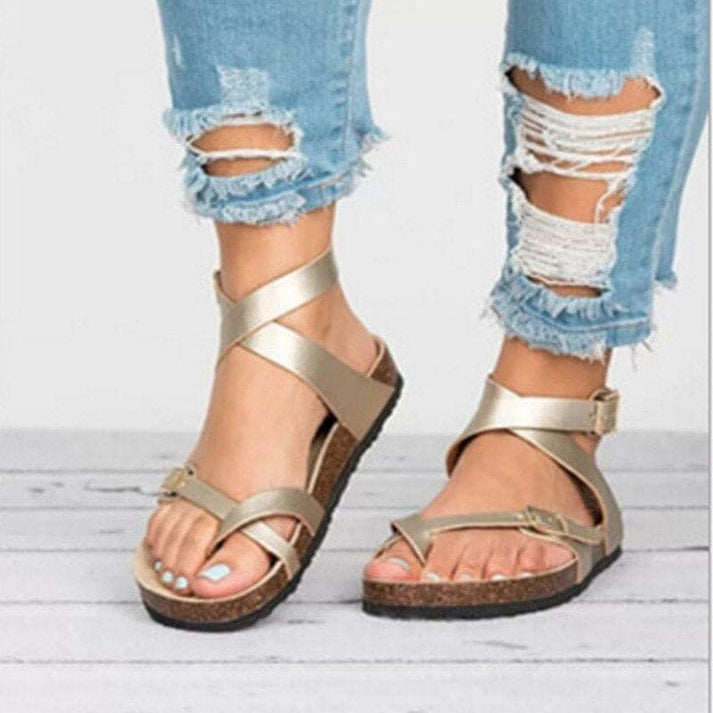 Comfortable women's flat walking sandals featuring breathable strappy design and an adjustable buckle for a perfect fit.
